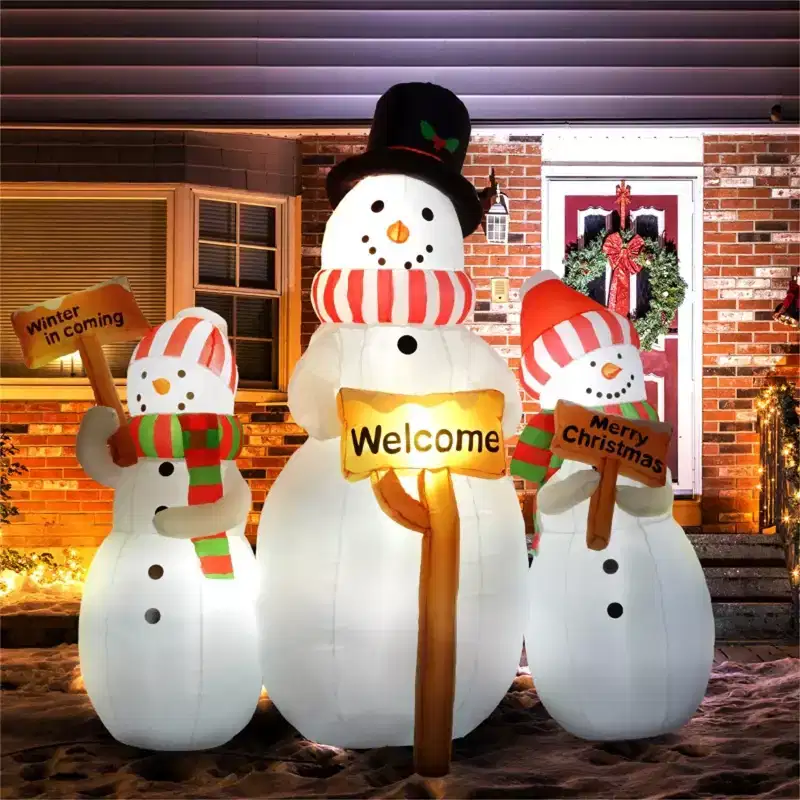 Christmas Snowman, Three inflatable Christmas snowmen each holding a sign