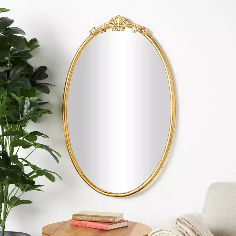 Olivia & May 38"x24" Metal Ornate Baroque Oval Wall Mirror Gold